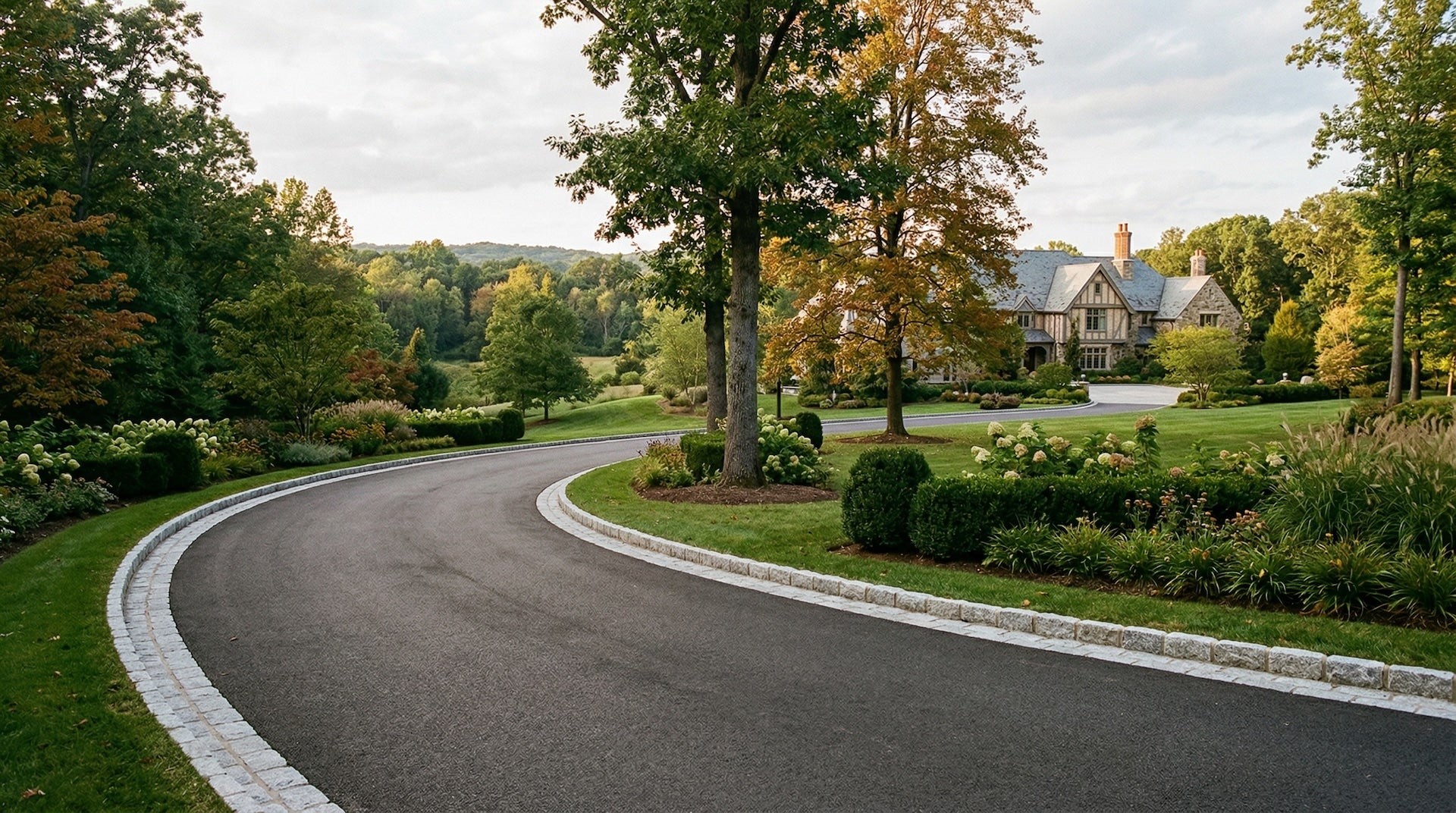 Large residential property with sweeping tarmac driveway