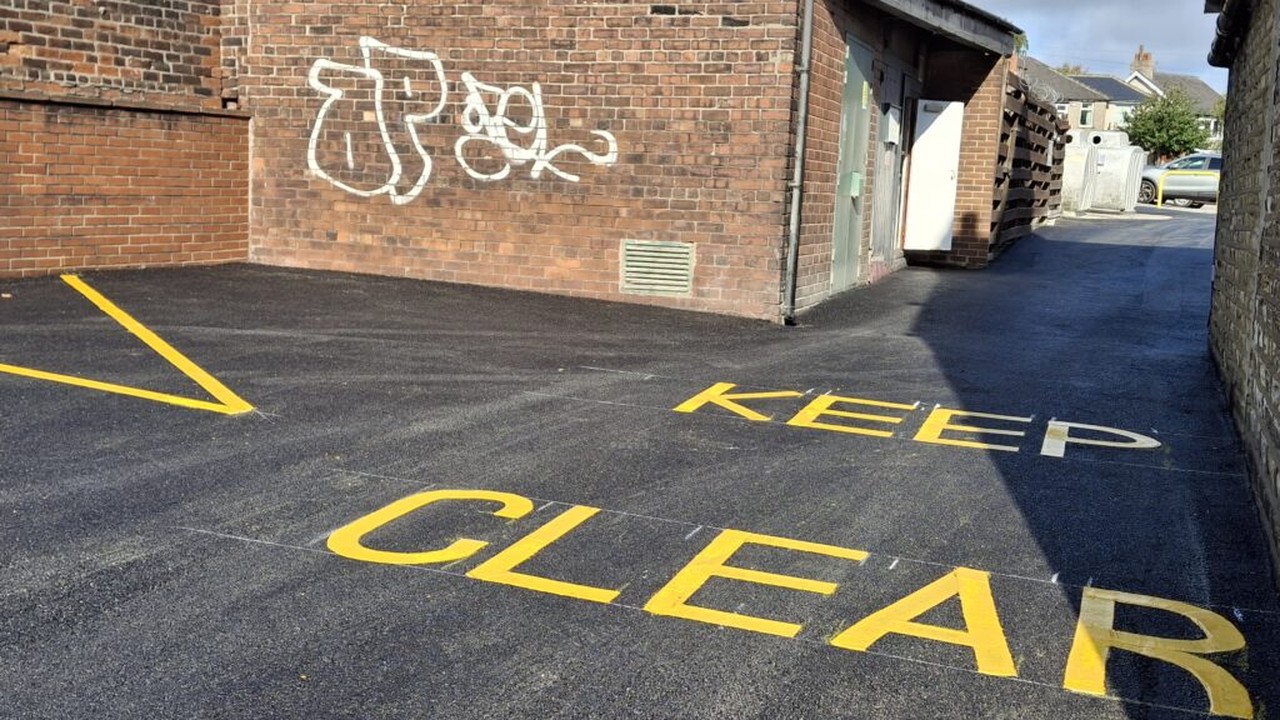 Fresh black tarmac with professional white line markings